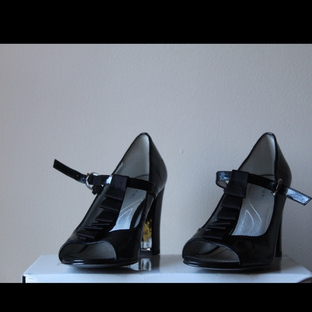 Tahari t- strap patent leather heels.